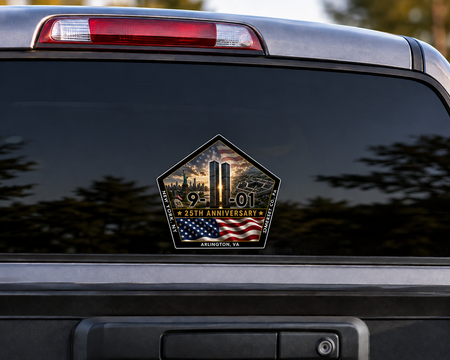 A sticker on the rear window of a vehicle commemorating the 25th anniversary of the September 11 attacks.